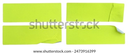 A set of fluorescent neon yellow rectangular paper sticker label isolated on white background.
