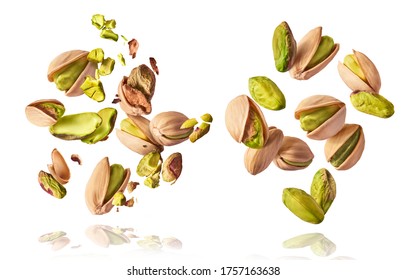 A set with Flying in air fresh raw whole and cracked pistachios  isolated on white background. Concept of Pistachios is torn to pieces close-up. High resolution image - Shutterstock ID 1757163638