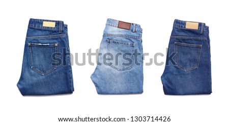 A set of folded jeans isolated on white background.