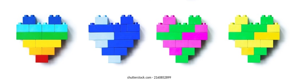 Set of four Colored Hearts from Legoblocks isolated on white background, colorful figure plastic blocks, shapes heart of child construction. Toys, games and recreation, top view design elements - Powered by Shutterstock