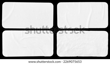Set of four crumpled paper sheets, each of which is isolated on black background. Rectangle shape has rounded edges. Template mockup