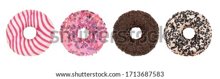Set of four different glazed donuts isolated on a white background.