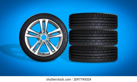 Set Of Four Wheels On Blue Background. New Tires On Aluminum Wheel Rims. No Logo Visible, Only Tire Labeling Visible.