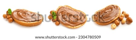 Set of fresh bread with chocolate paste and hazelnuts on white background