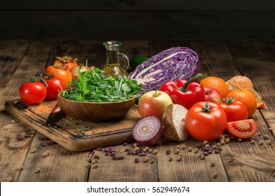 Set of fresh products for healthy food on wooden table on a black background - Powered by Shutterstock