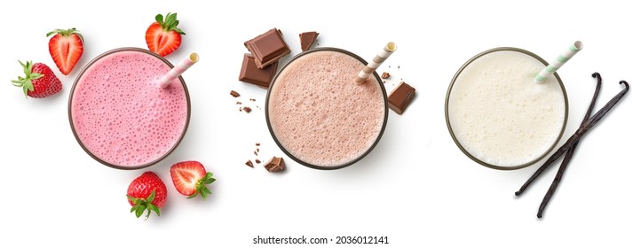 Set of fresh various delicious milkshakes or smoothies, top vies, isolated on white background. Strawberry, vanilla and chocolate flavor