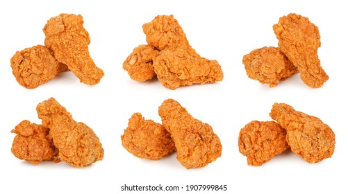 Set of fried spicy chicken legs isolated on white background.