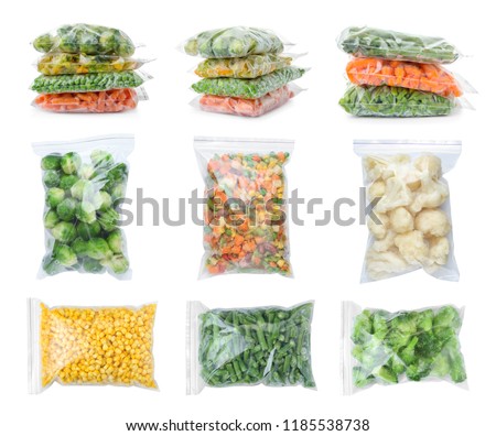 Set with frozen vegetables in plastic bags on white background