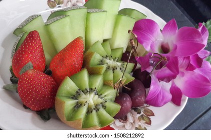 Set Of Fruits On Thievish: Cantaloupe, Strawberry, Kiwi And Red Cherry