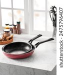 Set of frying or cooking pans. They are nonstick and iron cast. A set of pans from different size. Nonstick cookware is good for home usage only. The coating can be easily removed depend on quality