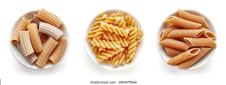 Set Of Full Grain Pasta In Bowl, Macherroni, Fusilli, Penne Isolated On White Background, Top View