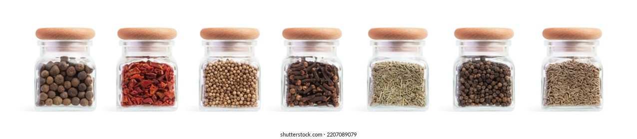 Set of glass jars with different spices on a white isolated background - Shutterstock ID 2207089079