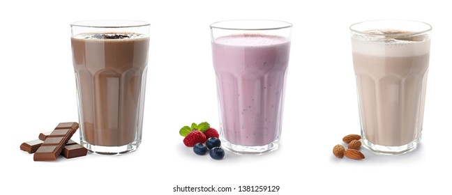 Set of glasses with delicious protein shakes on white background