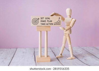 Set Goal Make Plan Take Action Motivation Concept with Wooden Mannequin Presenting Business Sign