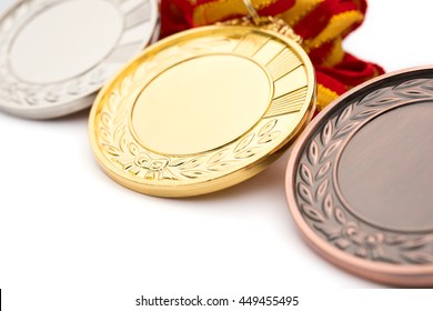 set of gold silver and bronze award medals on white background
