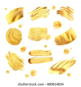 Set of golden paint strokes for your design. Isolated on White background