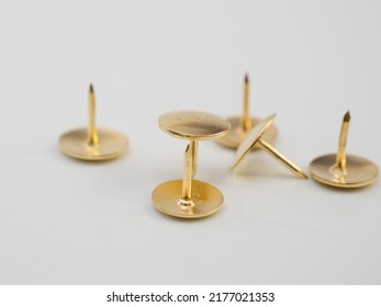 Set of golden thumbtacks. Golden buttons.
