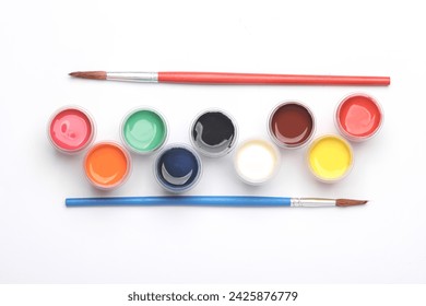 Set of gouache paints in bottles with brushes on a white background. Children's creativity - Powered by Shutterstock