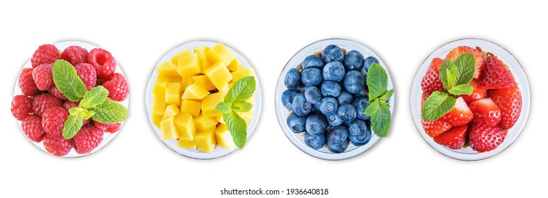 Set of Greek yogurt granola parfaits with strawberries, blueberries, mango fruits and raspberries in a glass on a white isolated background. toning. selective focus