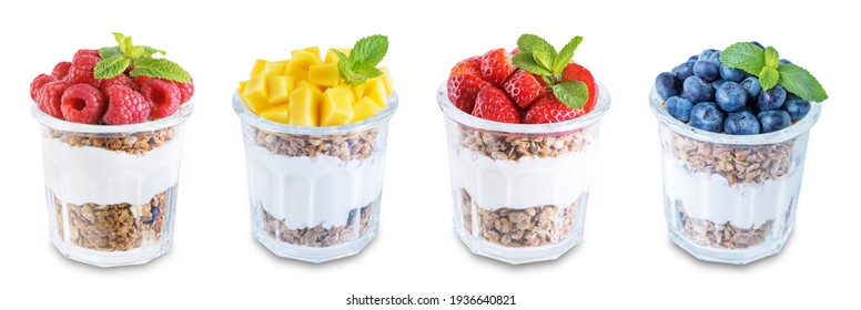 Set of Greek yogurt granola parfaits with strawberries, blueberries, mango fruits and raspberries in a glass on a white isolated background. toning. selective focus