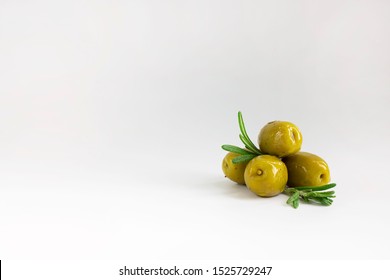 set of green marinated with herbs olives with fresh rosemary leaves on white background, horizontal with copy space. Isolate. Appetizer. - Powered by Shutterstock