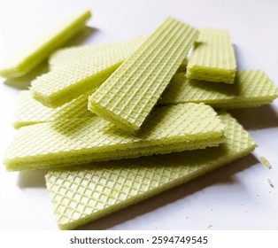 set of green rectangular wafers with matcha flavor on a white background 