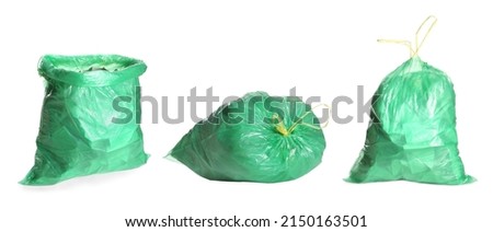 Set with green trash bags full of garbage on white background. Banner design