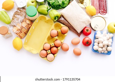 Set of grocery items from canned food, vegetables, cereal on white bacground. Food delivery concept. Donation concept. Top view. - Shutterstock ID 1791135704