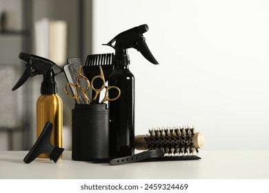 Set of hairdresser tools on table in salon, space for text - Powered by Shutterstock