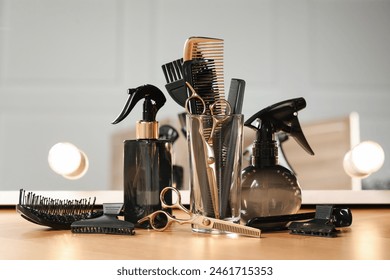 Set of hairdresser tools on table in salon - Powered by Shutterstock