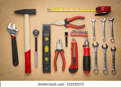 Set Of Hand Tools On A Wooden Panel Close Up