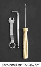 Set Of Hand Tools: Wrench And Screwdrivers On Black Background