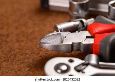 Set of hand various work tools on rusty background. Close up.