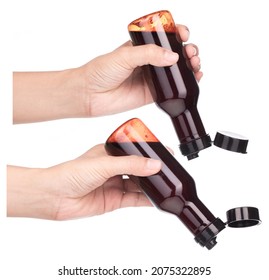 Set of Hands holding spicy sauces in glass bottles and pouring ​isolated on a white background. - Shutterstock ID 2075322895