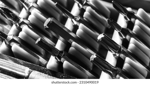 Set of heads for screwdriver bits. Tools collection copy space, close up, selective focus. blurred dark background