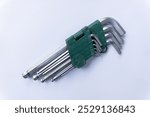 A set of hex keys, also known as Allen wrenches, in a convenient green plastic holder.