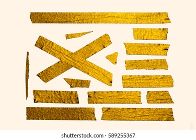 A Set Of Homemade Gold Paper Tape Pieces