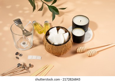 Set for homemade natural eco-friendly coconut wax candles, wick, perfume, aroma oil. Candle making utensils.Trendy diy candles to health on beige background.Copy space.Cruelty-free vegan product