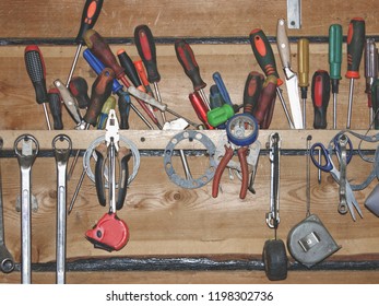 A set of homemade work tools in the workplace in the workshop.