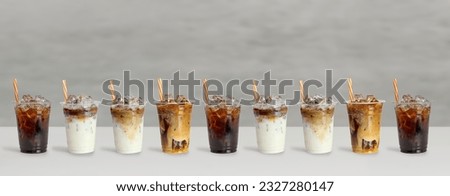 Set of ice caramel latte coffee, coffee with cream and cold brew black amricano coffee  isolated on dramatic grey background.