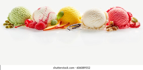 Set of ice cream scoops of different colors with fruits, berries and nuts decorations isolated on white background with copy space - Shutterstock ID 606089552