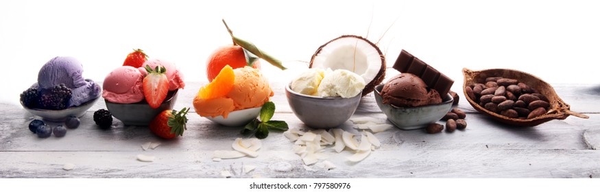 Set Of Ice Cream Scoops Of Different Colors And Flavours With Berries, Nuts And Fruits 