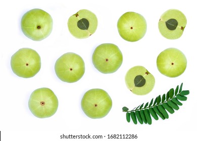 Set of Indian gooseberry fruits ( Amla,  phyllanthus emblica ) and cut in half slice with green leaves isolated on white background as for package design. Top view. Flat lay.