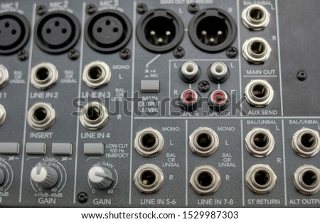 Set of inputs and outputs of an analog audio mixing console, with its auxiliary lines, main, returns, tape in and tape out, main output level, gain and another parameters