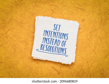 set intentions instead of resolutions inspirational advice or reminder - handwriting on a handmade paper, goal setting and personal development concept - Shutterstock ID 2096680819