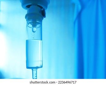 Set IV fluid intravenous drop saline drip hospital room, ,medical concept, treatment patient emergency and injection drug infusion care. Blue light background hospital, Selective Focus. - Powered by Shutterstock