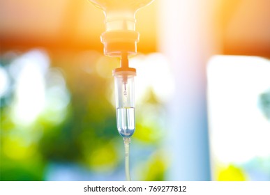 Set Iv Fluid Intravenous Drop Saline Drip Hospital Room,Medical Concept,treatment Emergency And Injection Drug Infusion Care Chemotherapy, Concept.blue Light Background 