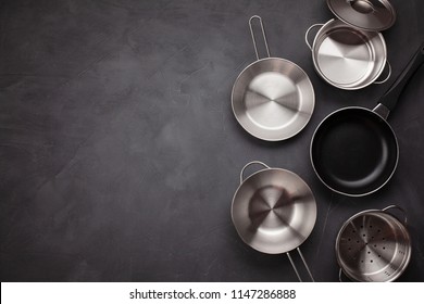 Set of kitchen metallic pans. Mockup, kitchen utensils, recipe book, cooking classes concept