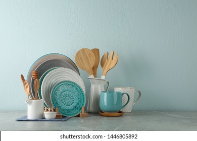 Set of kitchenware on grey marble table near light wall, space for text. Modern interior design - Shutterstock ID 1446805892