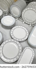 set of light colored plates for table setting